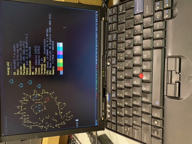  A picture of the laptop with neofetch.